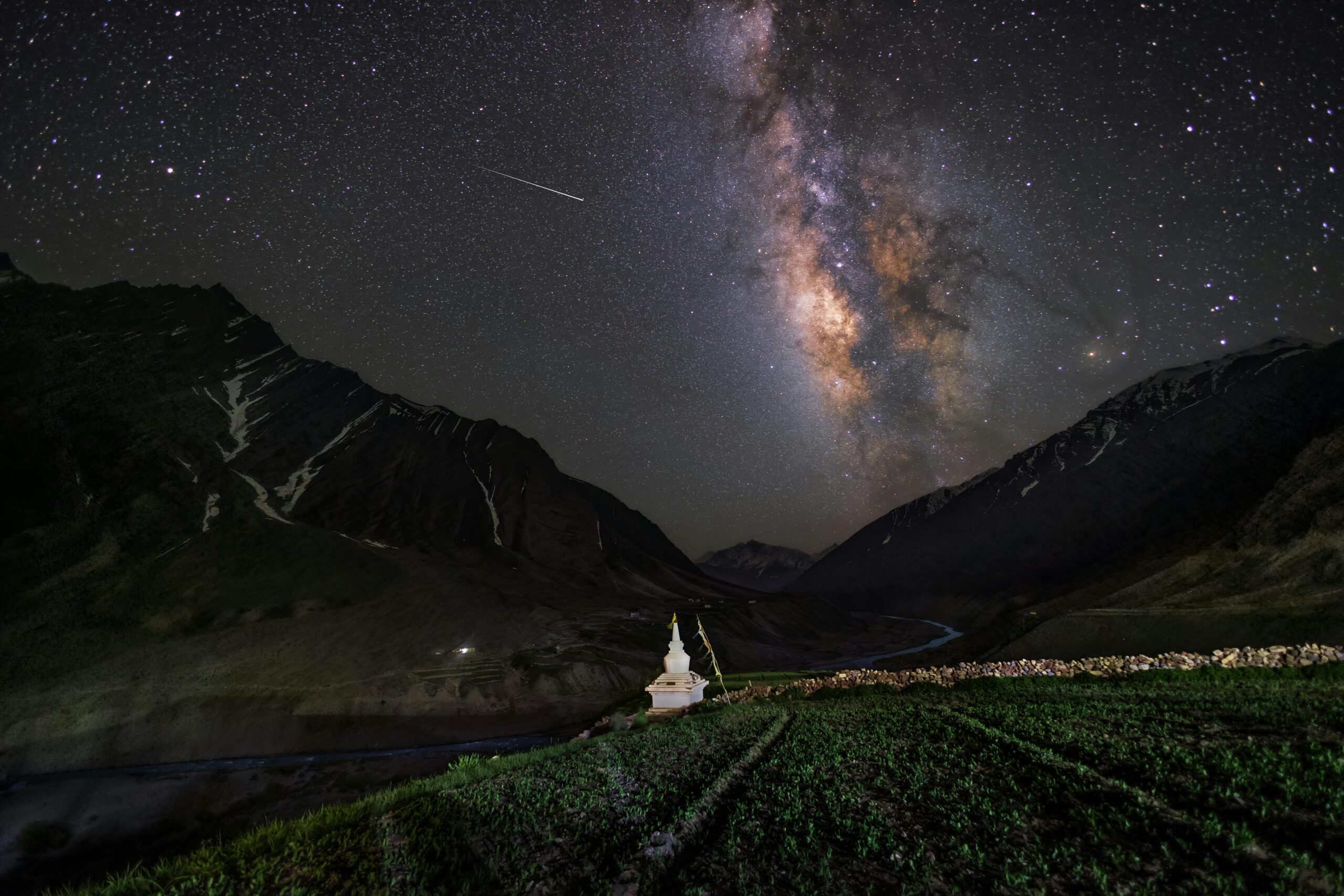 Milky Way galaxy over a scenic valley in Kaza, Himachal Pradesh, India at night.