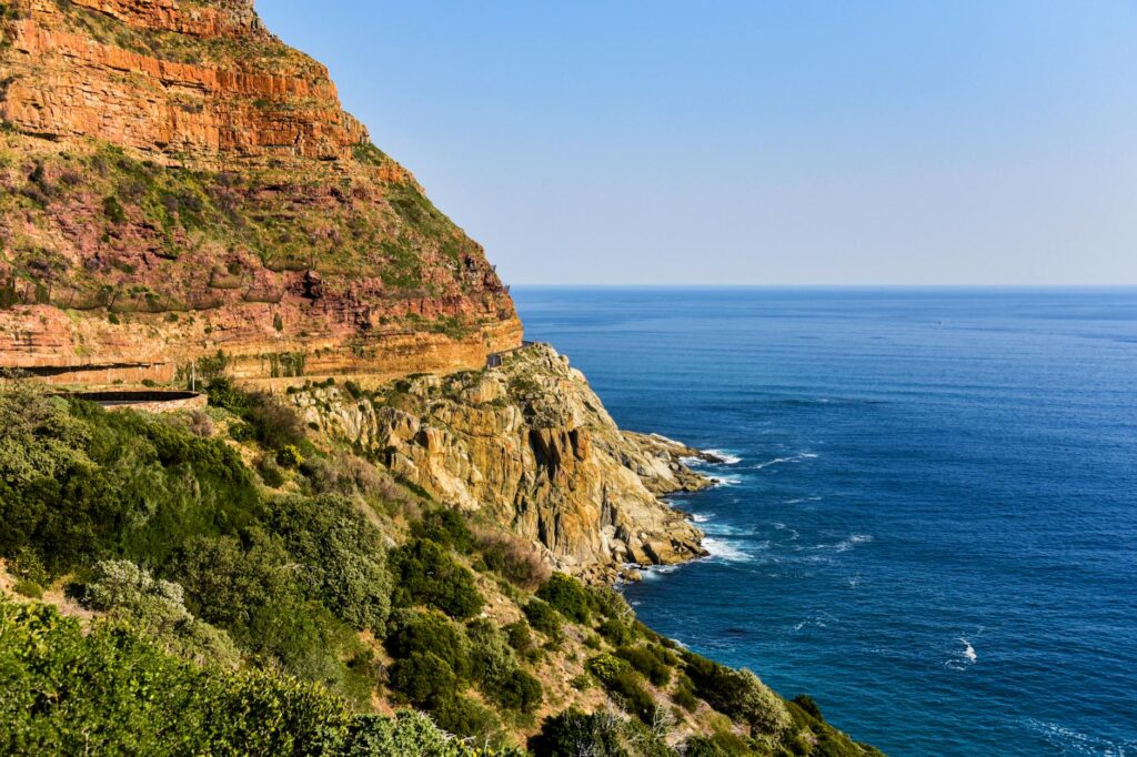 Beautiful coastal cliffs and ocean view in South Africa, showcasing nature's vibrant hues.