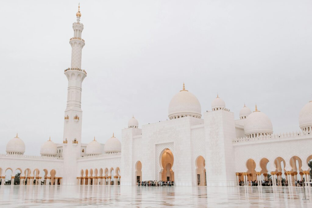 Majestic view of Sheikh Zayed Grand Mosque in Abu Dhabi with its stunning white domes and minarets.